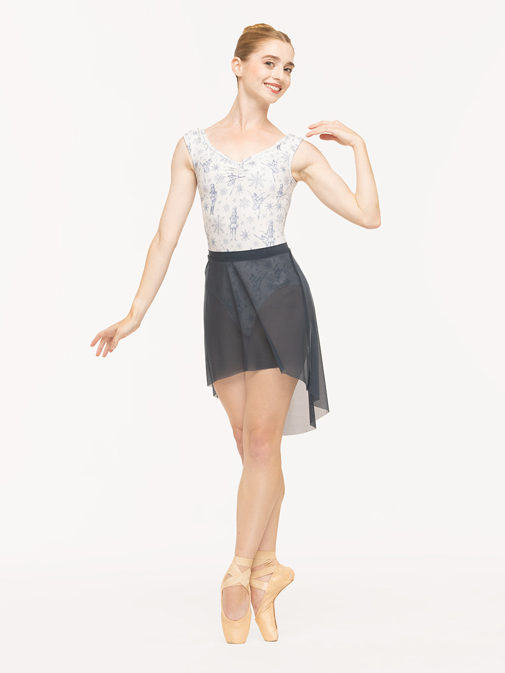 Eleve Dancewear Heather Leotard in Snow Scene print, front view of dancer on pointe fifth