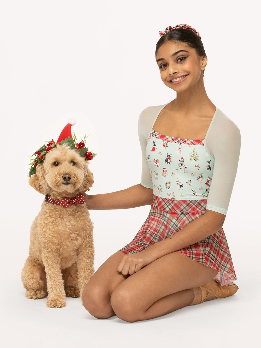Eleve Dancewear Chris Leotard Christmas Kids in Dogs Spearmint print, front view of dancer with a cute doggy