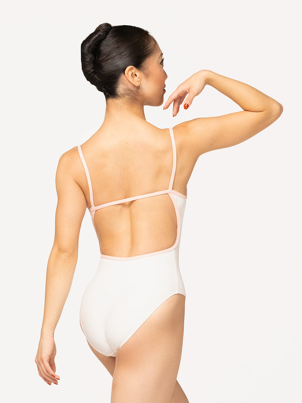 Eleve Dancewear Candy Leotard in Stage White color, back view of dancer posing