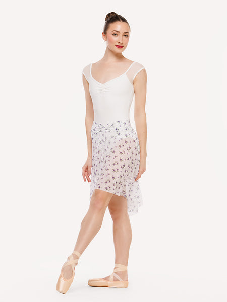 Eleve Dancewear Amora Long High-Low Skirt in Pathway Mesh print, front view of dancer on tendu devant croise