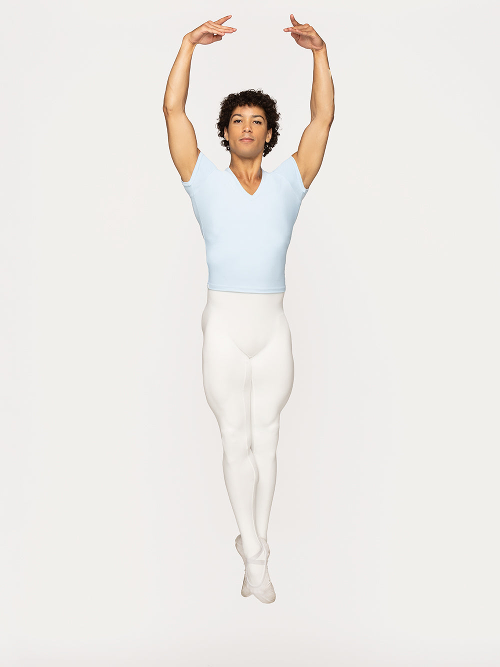 Eleve Dancewear John Shirt in True Blue color, front view of dancer on saute in fifth position