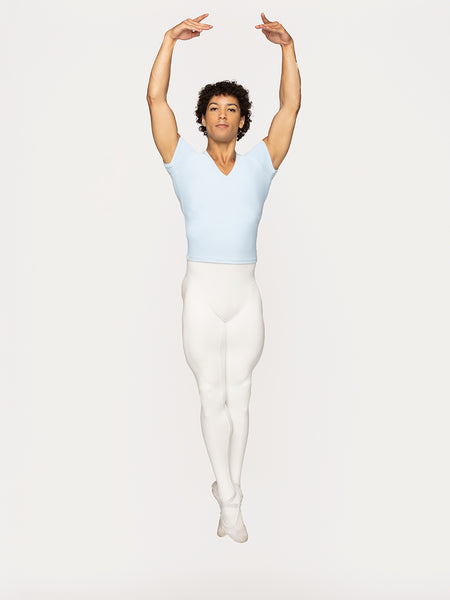 Eleve Dancewear Ryan Tights in Stage White color, front view of dancer on fifth jump