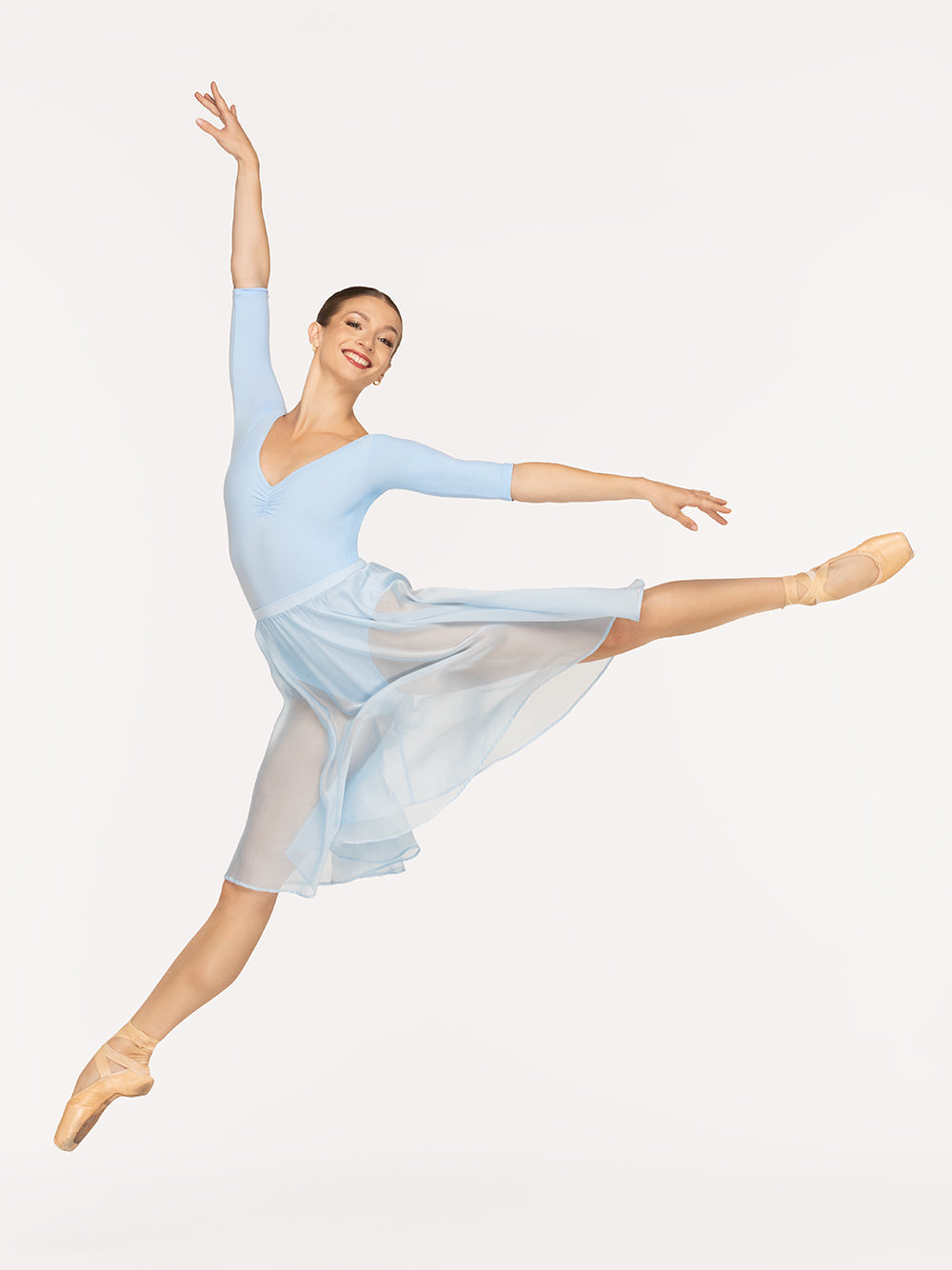 Eleve Dancewear Chiffon Rehearsal Skirt in True Blue color, front view of dancer on sissonne