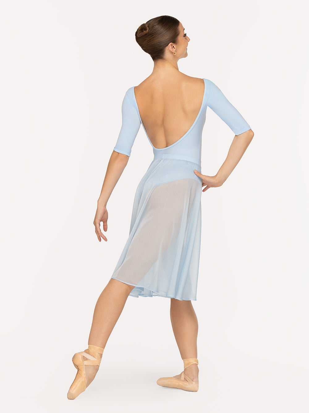 Eleve Dancewear Chiffon Rehearsal Skirt in True Blue color, back view of dancer on tendu derriere croise