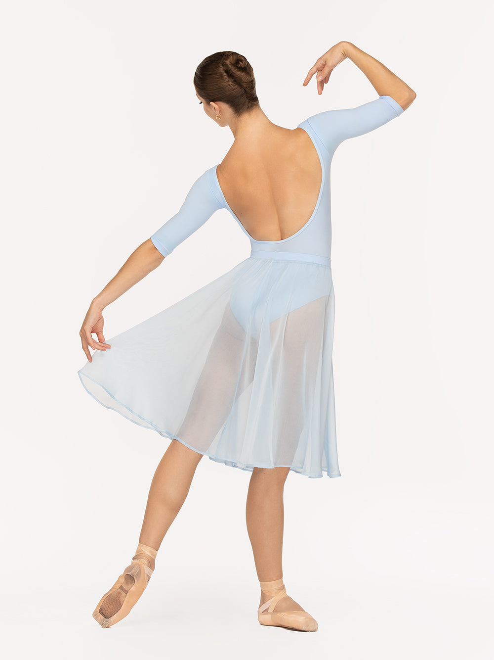 Eleve Dancewear Chiffon Rehearsal Skirt in True Blue color, back view of dancer on tendu derriere efface