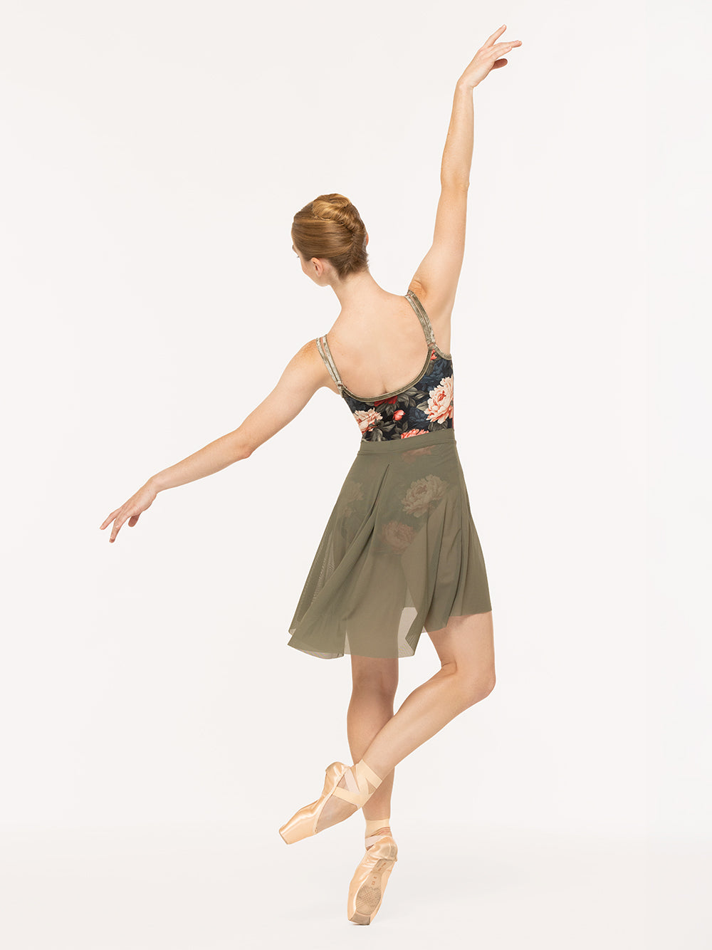 Eleve Dancewear Farrah Leotard in Winter Florals print, back view of dancer on cou-de-pie