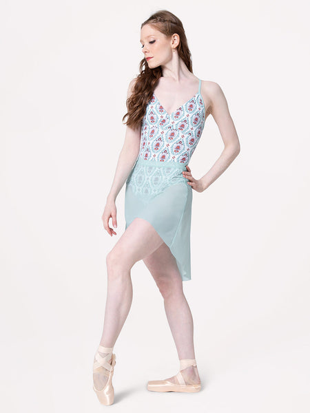 Eleve Dancewear Mid High-Low Skirt in Pool Mesh print color, front view of dancer posing