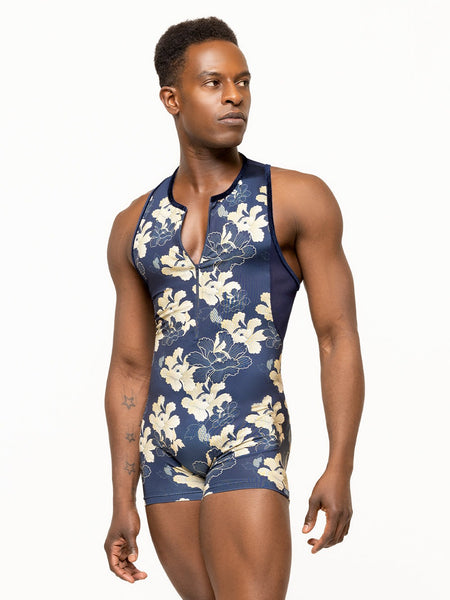 Model is wearing navy mens bodysuit with mesh racer back and gold floral print.