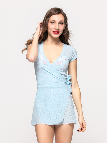 Model in blue lace wrap dress