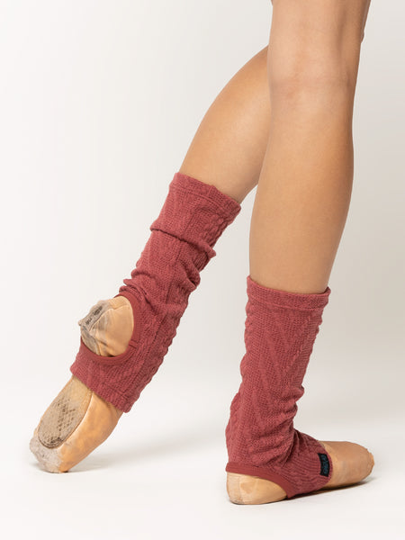 Back of stirrup ankle length leg warmers in dark pink cable knit