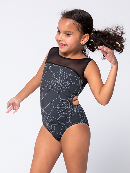 Model in profile view pose and in leotard with black spiderweb and mesh leotard 