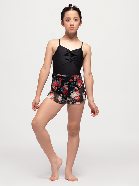 Model in black crop top and floral pattern mesh skirt 
