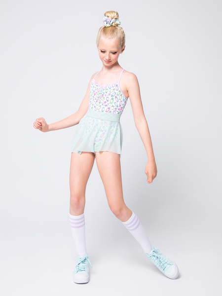 Model is in candy patterned leotard with sea glass mesh skirt