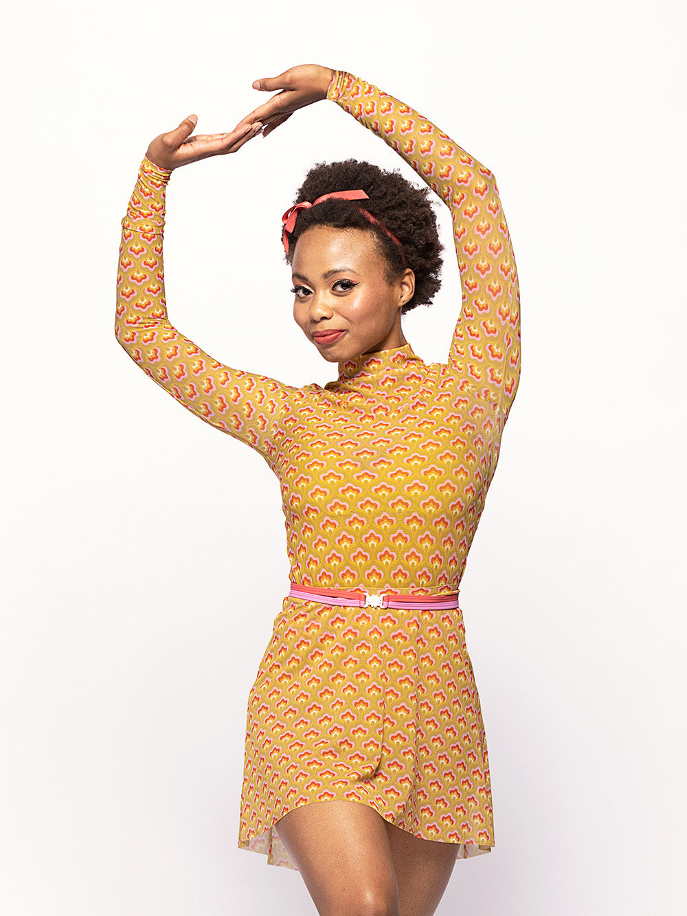 Eleve Dancewear Short High-Low Skirt in Peace & Love Mustard Mesh print color, detail front view
