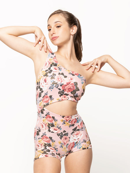 Model in pink floral Biketard with open side front and back