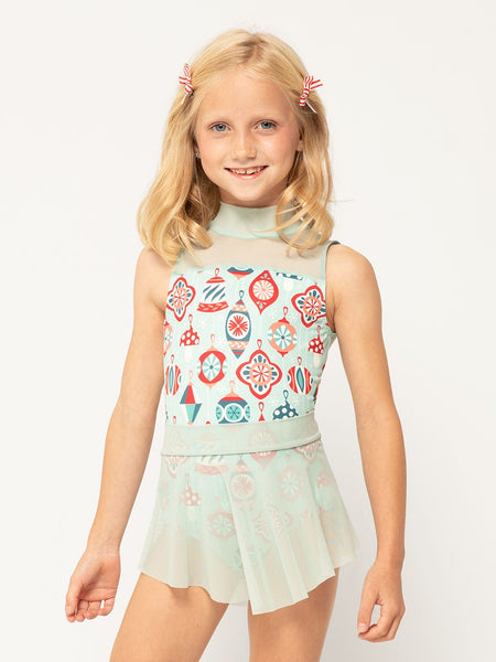 Model is in Ornament patterned leotard with sea glass mesh skirt