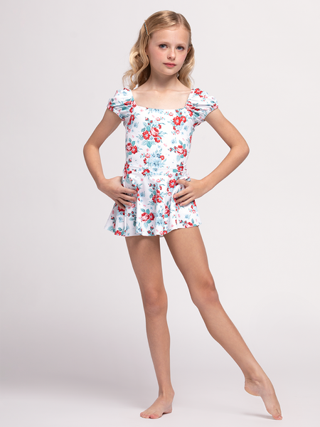 Model in white floral pattern leotard and matching skirt 